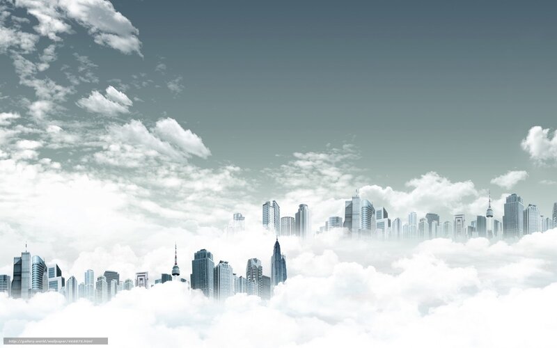 City skyline above clouds