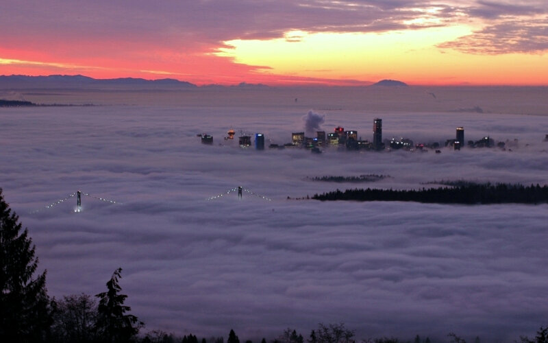 City Skyline Above Fog — Purple