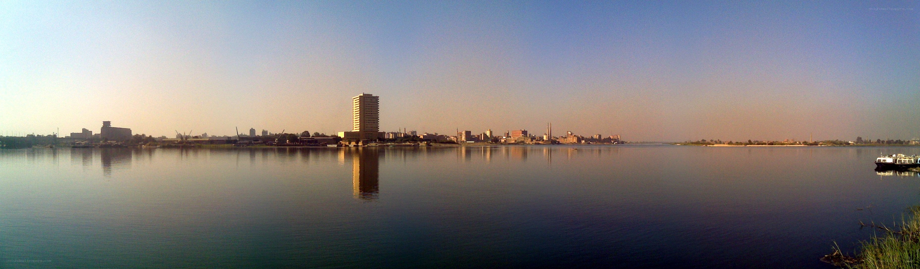 city skyline across a river