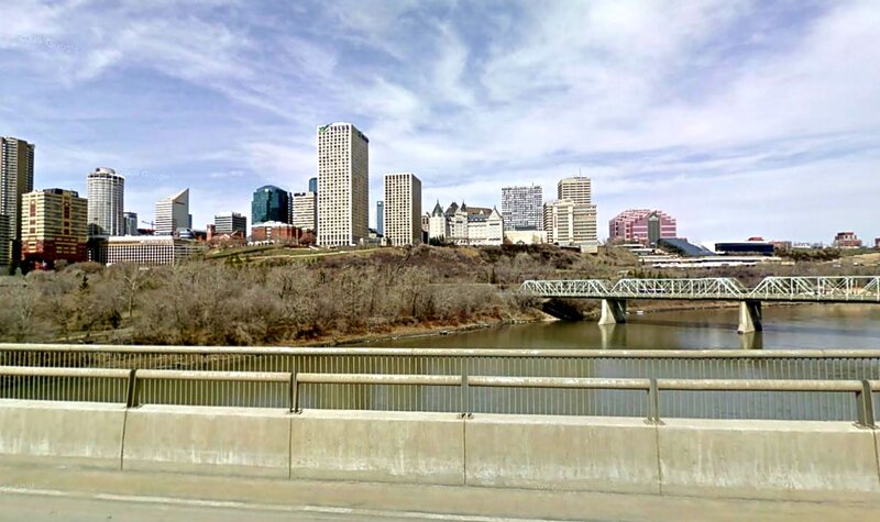 City Skyline Across River — Blue, Calm, Afternoon