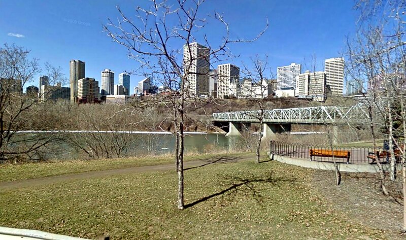 City Skyline Across River — Blue, Calm, Spring