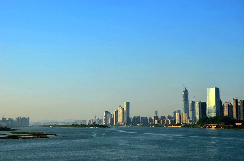 City Skyline Across River — Blue, Serene