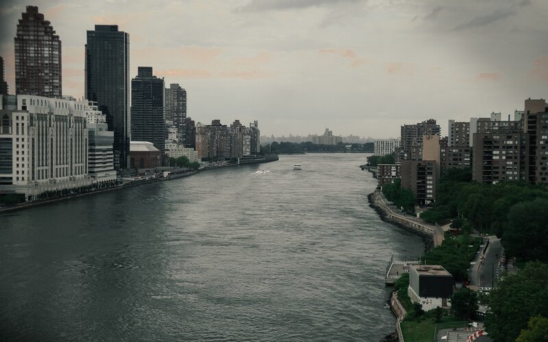 city skyline along river