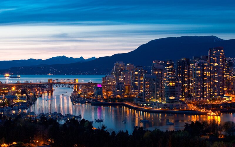 City Skyline at Dusk — Blue, Serene, Night, Photograph, Bridge, Mountains