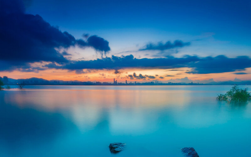 City Skyline at Dusk — Blue, Serene, Sunset, Photograph, Mountains