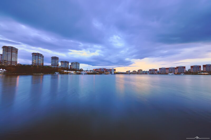 City skyline at dusk by the water