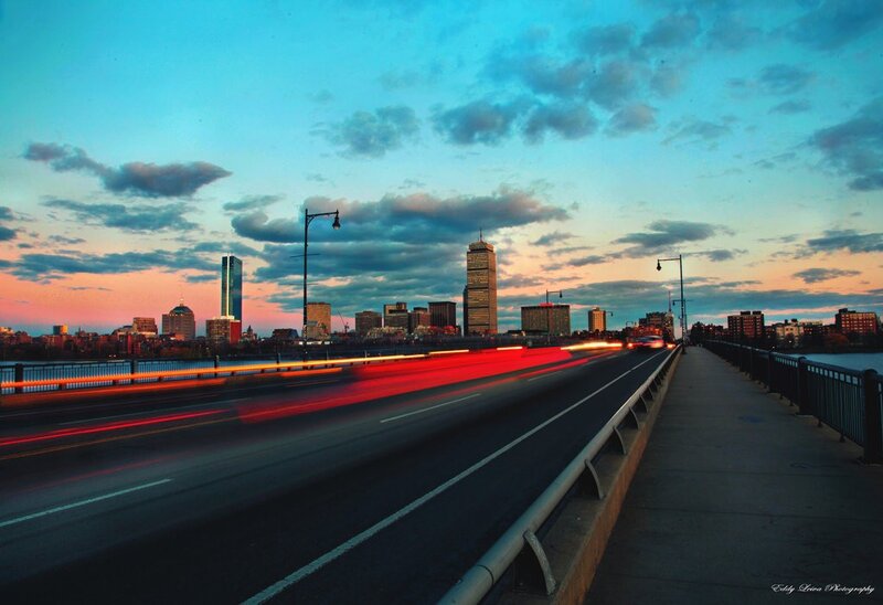 City skyline at dusk from a bridge