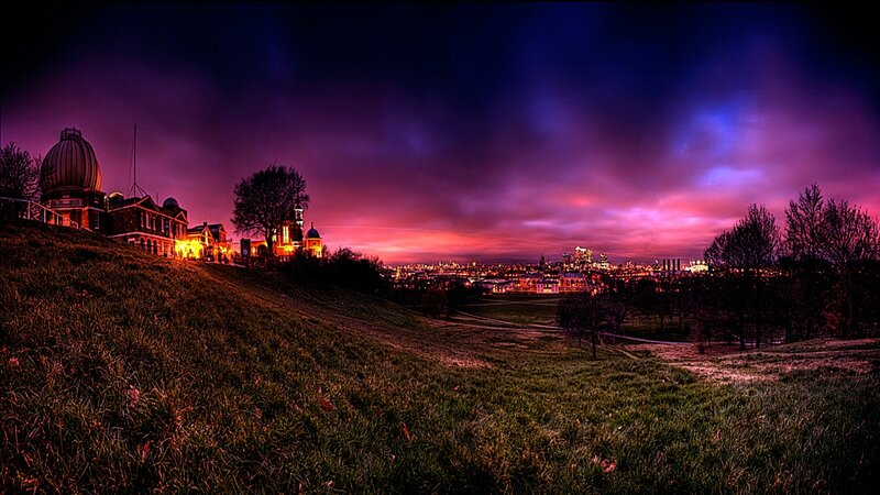 City skyline at dusk from a hill
