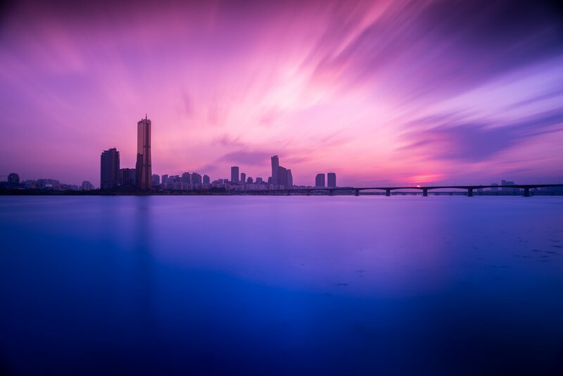 City Skyline at Dusk — Purple, Serene, Sunset, Photograph, Skyscraper, Bridge