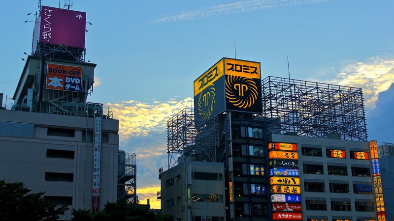 City skyline at dusk with billboards
