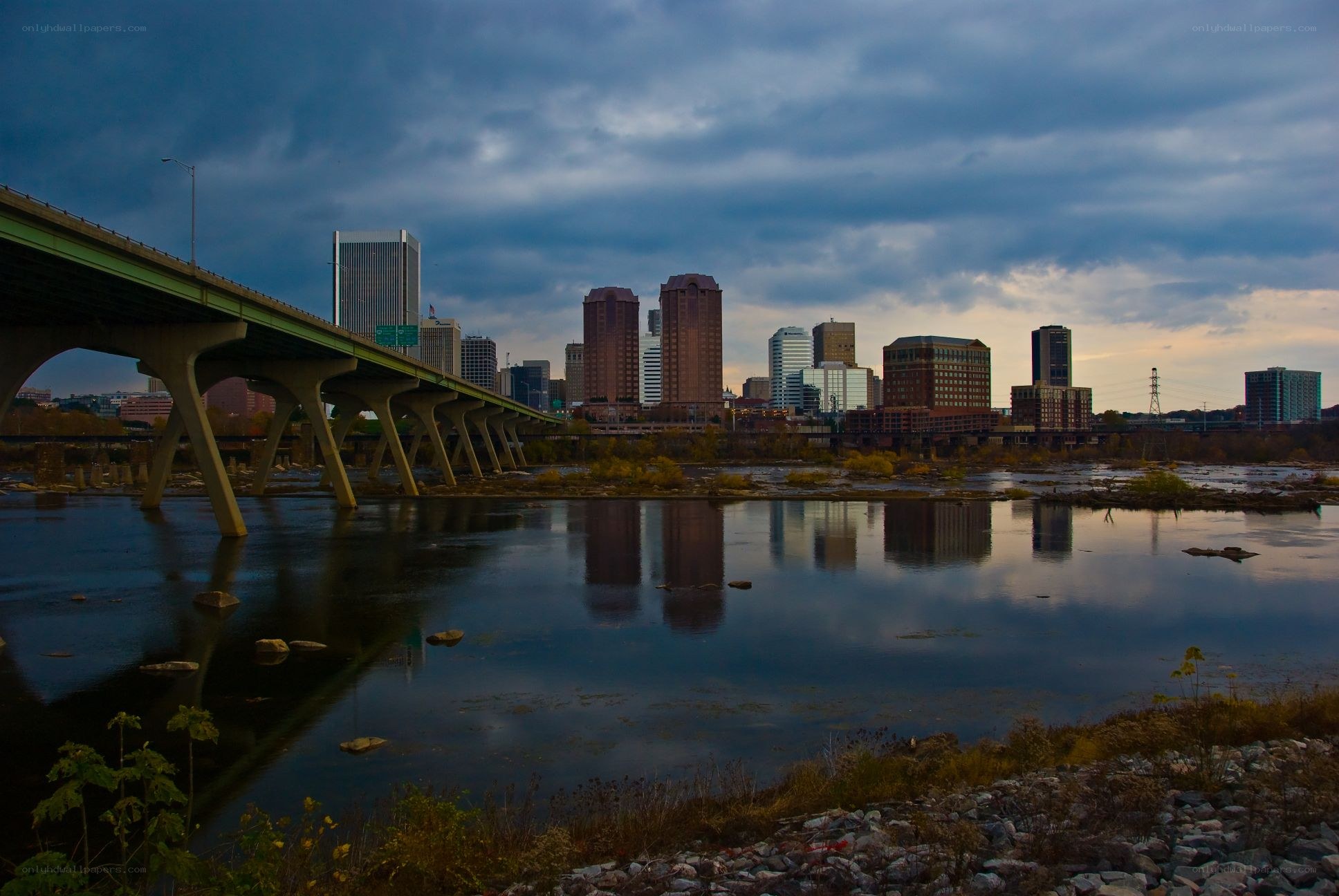 City skyline at dusk with bridge