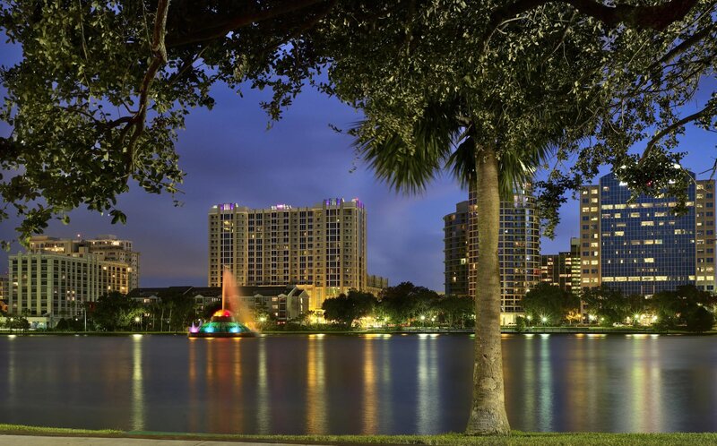 City skyline at dusk with fountain
