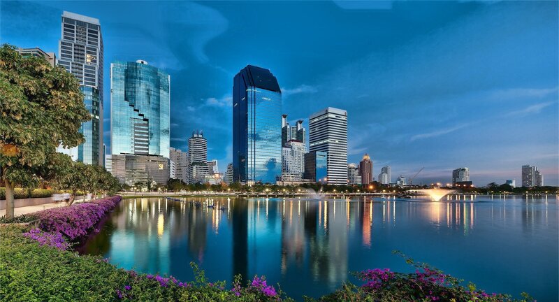 City skyline at dusk with lake