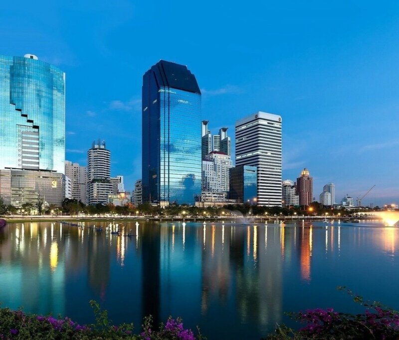 City skyline at dusk with lake