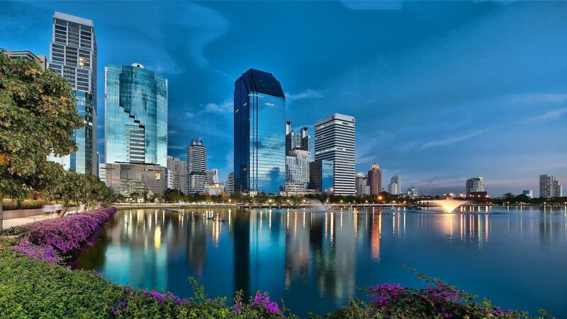 City skyline at dusk with lake
