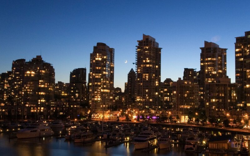 City skyline at dusk with marina