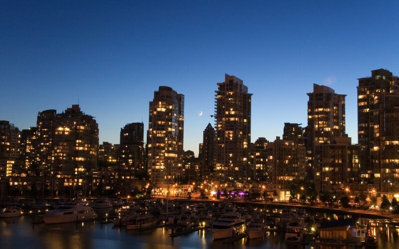 city skyline at dusk with marina
