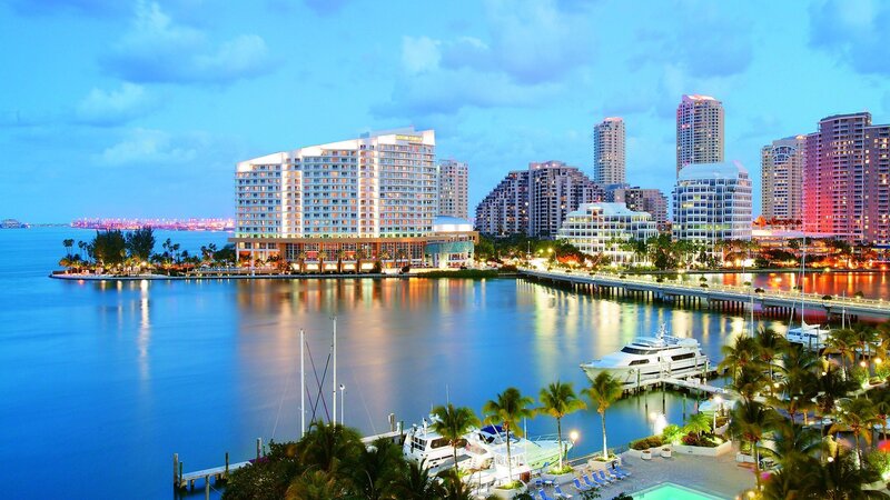 City skyline at dusk with marina