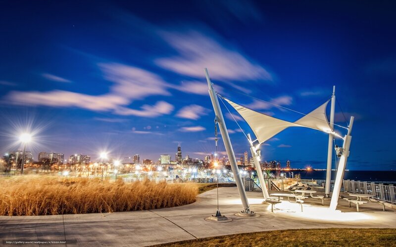 City skyline at dusk with modern pavilion