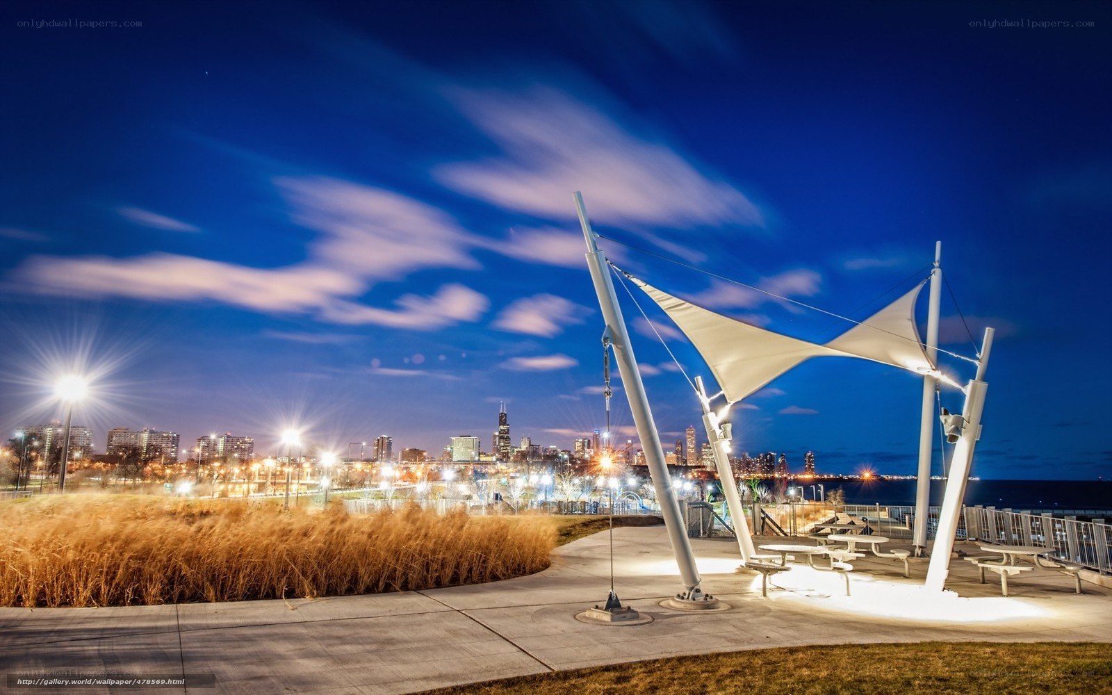 City skyline at dusk with modern pavilion