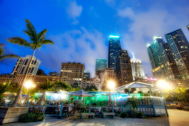City skyline at dusk with outdoor dining