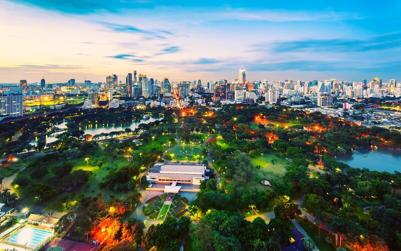 City skyline at dusk with park