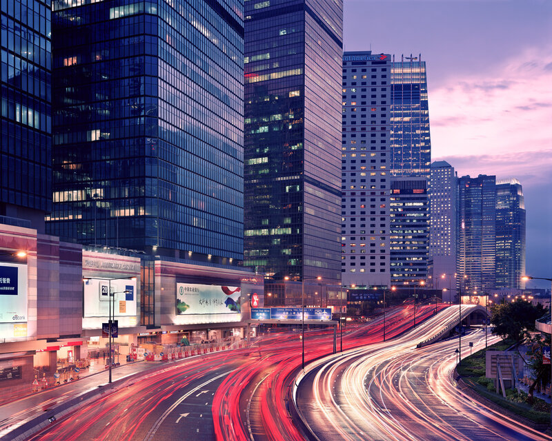 City skyline at dusk with traffic