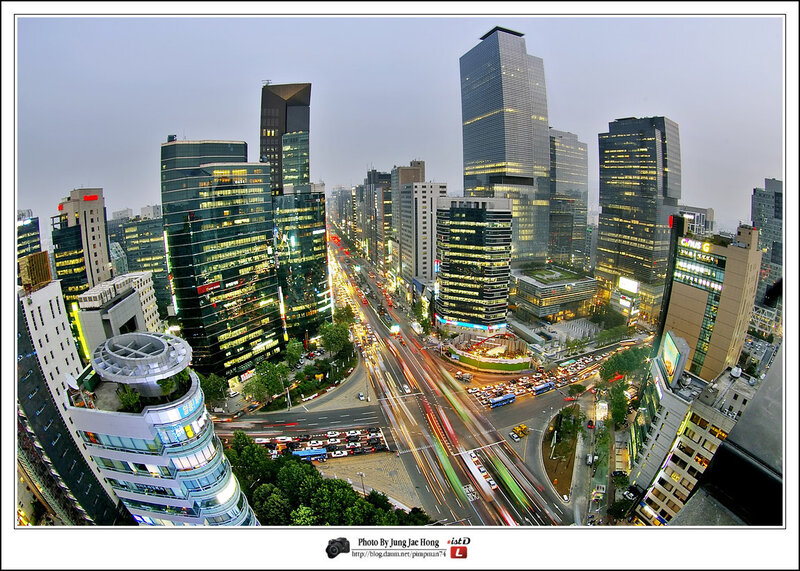 City skyline at dusk with traffic