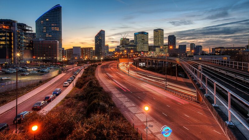 City skyline at dusk with traffic