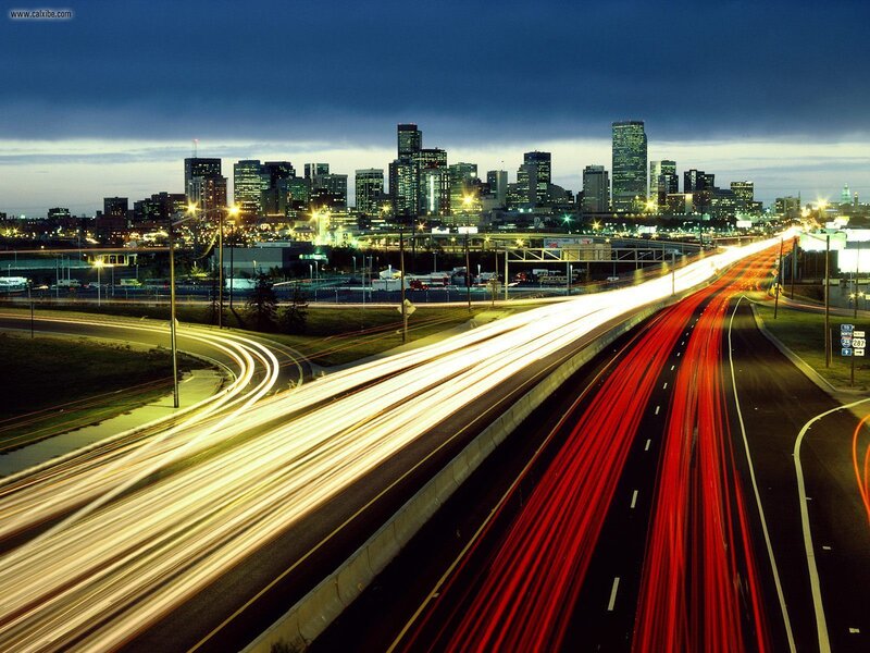 City skyline at dusk with traffic