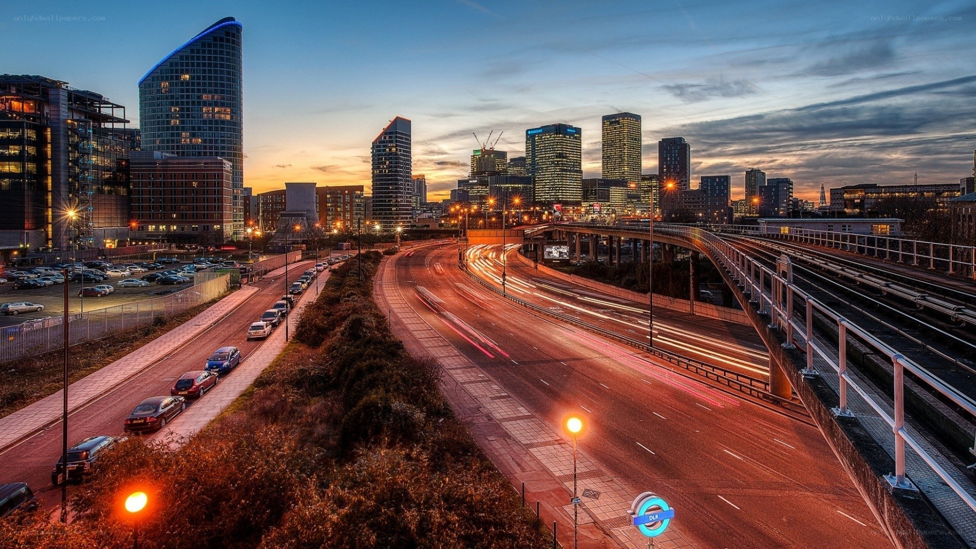 City skyline at dusk with traffic