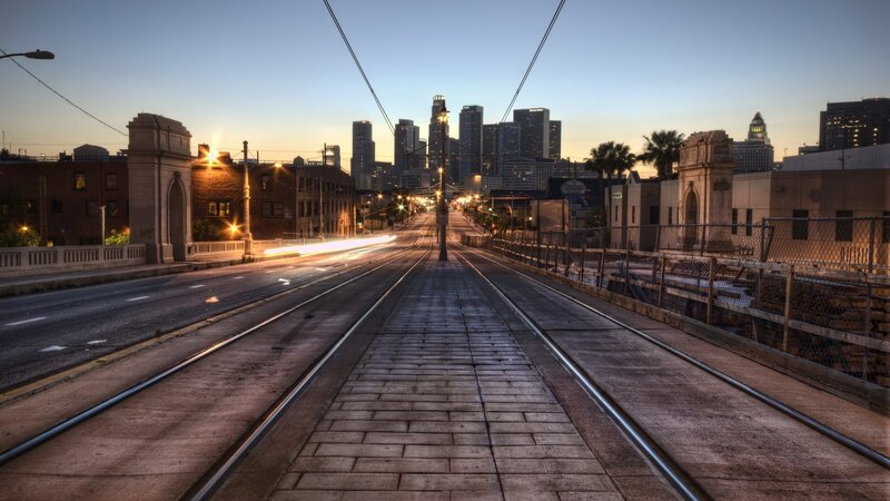 City skyline at dusk with tram tracks
