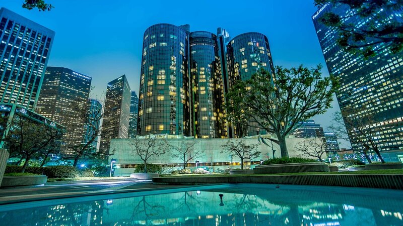 City skyline at dusk with water feature
