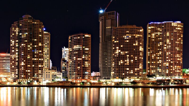City Skyline at Night — Black, Calm, Photograph, Skyscrapers, River