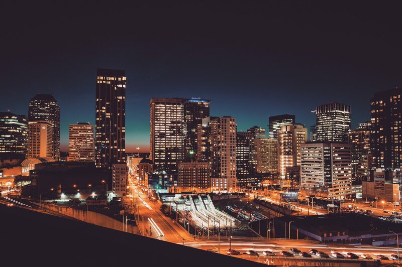 City Skyline at Night — Black, Dramatic, Photograph, Skyscrapers, Highway, Light Trails