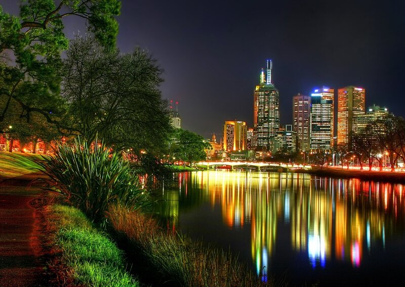 City Skyline at Night — Black, Serene, Photograph, River, Bridge, Trees, Yellow, Blue