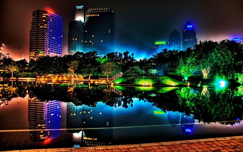 City Skyline at Night — Blue, Dramatic, Photograph, Buildings, Trees, Pond, Green