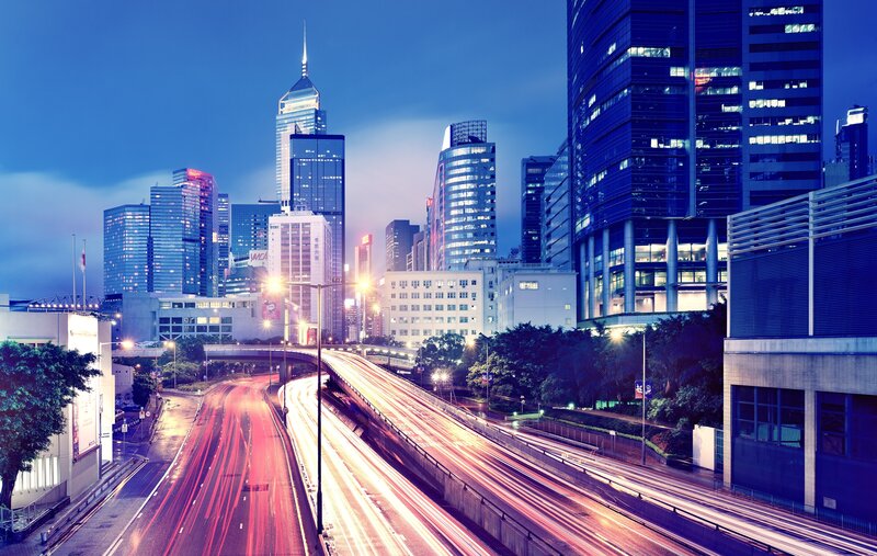 City Skyline at Night — Blue, Dramatic, Photograph, Skyscrapers, Highway, Light Trails