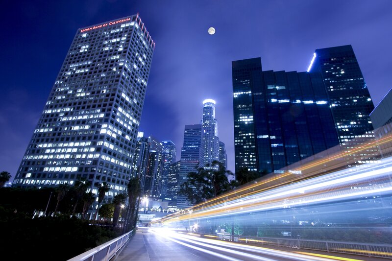 City Skyline at Night — Blue, Dramatic, Photograph, Skyscrapers, Moon, Light Trails