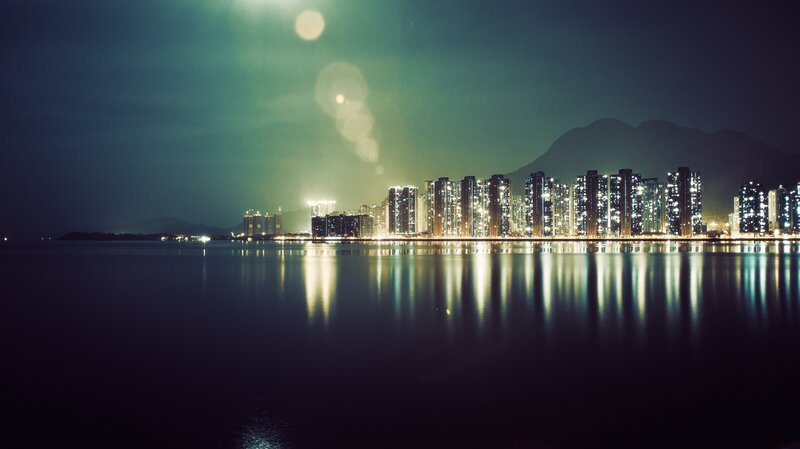 City Skyline at Night — Blue, Serene, Photograph, Buildings, Mountain