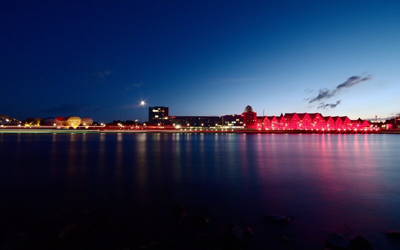 City Skyline at Night — Blue, Serene, Photograph, Buildings, River, Lights