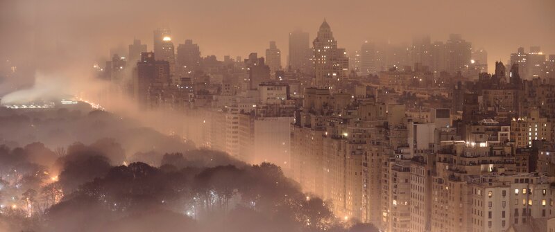 City Skyline at Night — Orange, Hazy