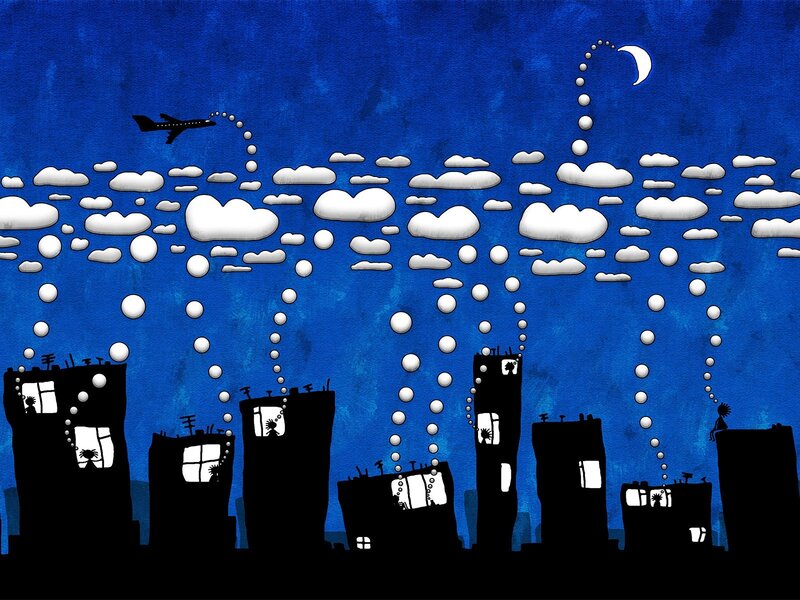 City skyline at night with airplane