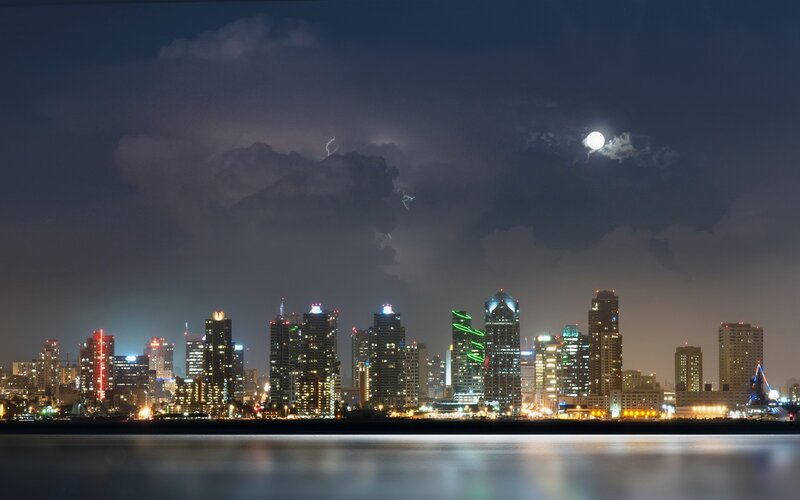 City skyline at night with lightning