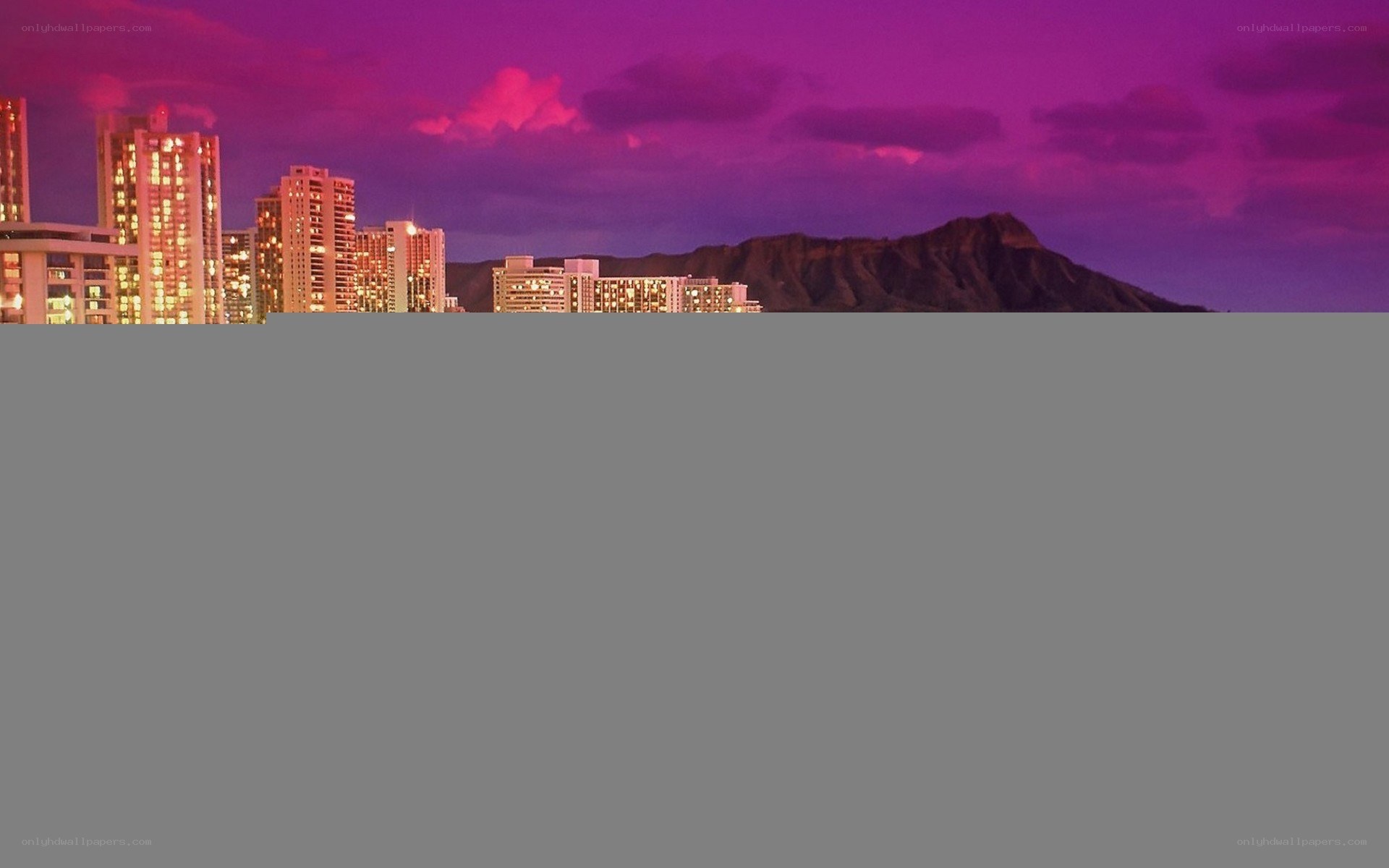 city skyline at purple sunset