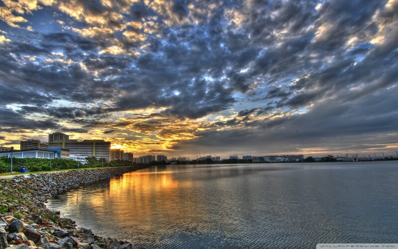 City Skyline at Sunset — Blue, Dramatic, Photograph, Clouds, Water