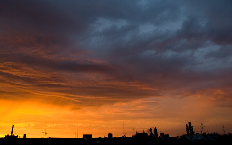 City Skyline at Sunset — Orange, Dramatic, Photograph, Clouds, Buildings