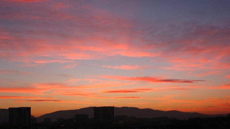 City Skyline at Sunset — Orange, Dramatic, Photograph, Mountains