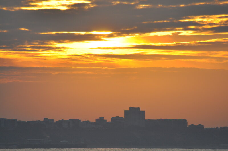 City Skyline at Sunset — Orange, Dramatic, Photograph, Sky, Clouds, Buildings