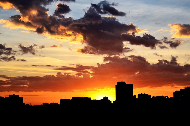 City Skyline at Sunset — Orange, Dramatic, Photograph, Sky, Clouds, Buildings, Yellow